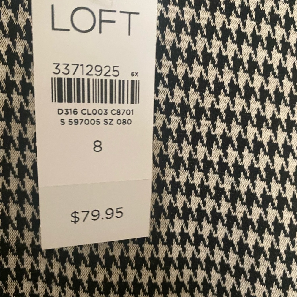 LOFT BLACK AND IVORY DRESS , with Ruffle trim size 8, fits above the knee